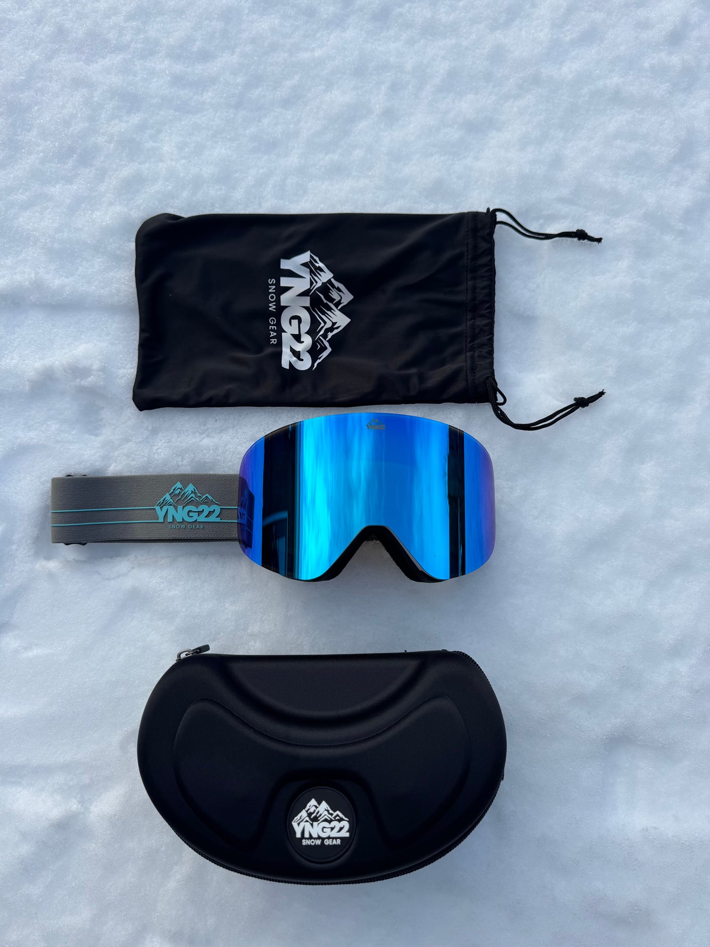 Skibril met verwisselbare lens, grijze band met blauwe lens verpakt in de hardcase/beschermdoos