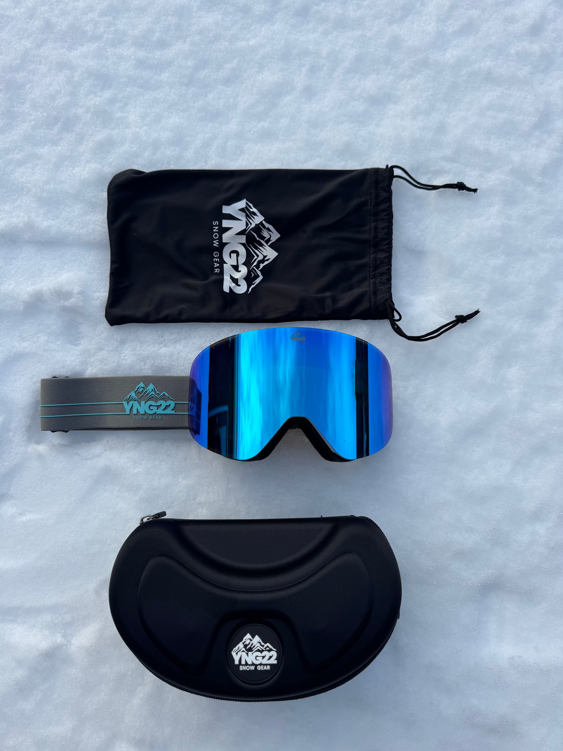 Skibril met verwisselbare lens, grijze band met blauwe lens verpakt in de hardcase/beschermdoos