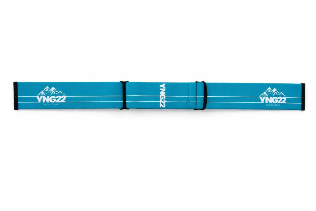Blauwe verwisselbare skibril band met wit YNG22-logo, geschikt voor ski- en snowboardbrillen.